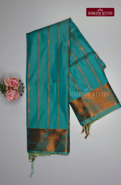 Looking for a gorgeous saree for a special occasion? Look no further! Our Kanchi Semi Silk Saree features a stunning peacock border and intricate all over kodi pattern, making it the perfect festive wear. With attached blouse material and free shipping, this beautiful blue saree is the best deal you'll find!