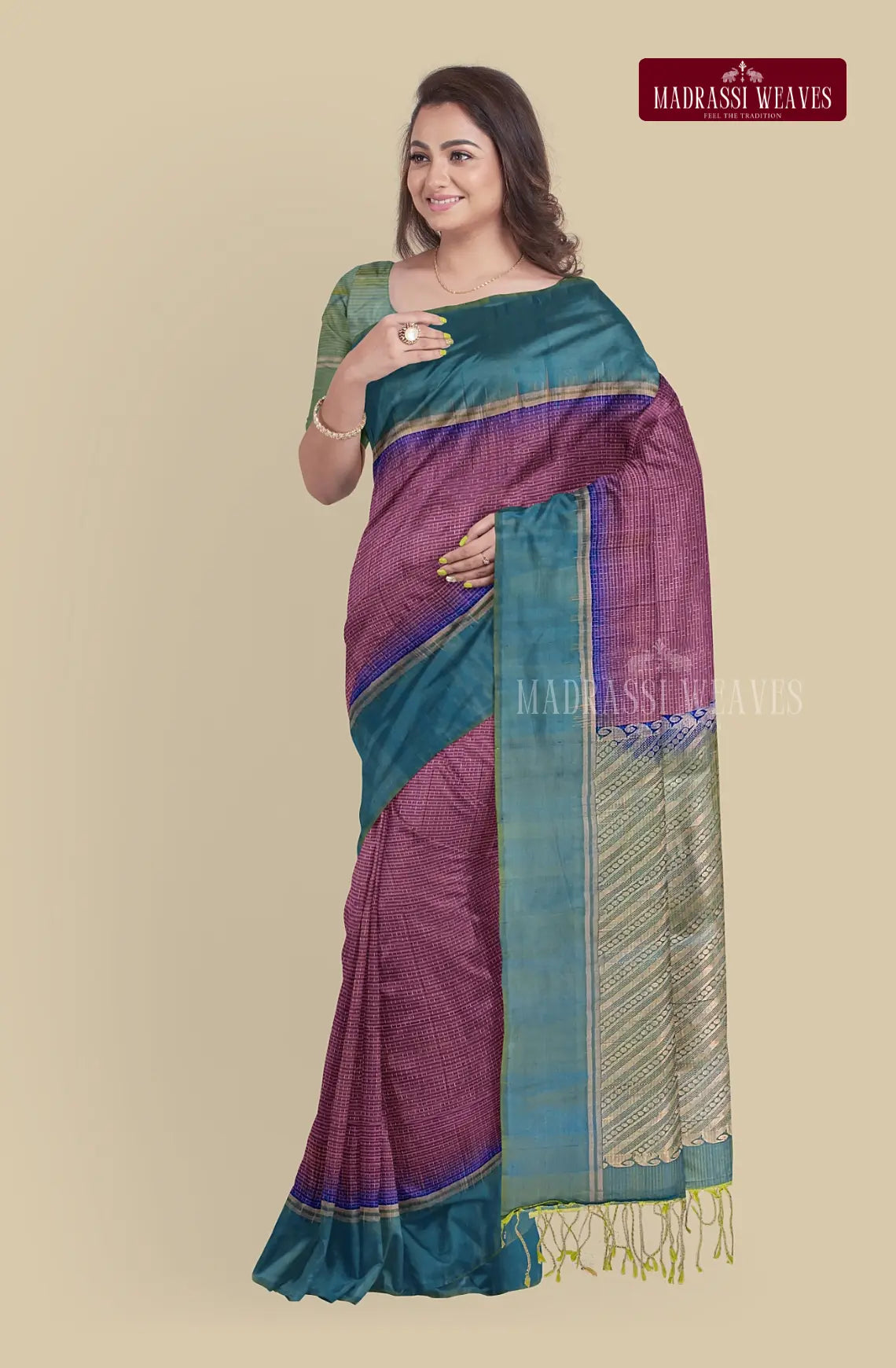 Crafted from pure silk, this Kanjeevaram saree boasts a gorgeous beetroot red hue and intricate meena butta work. Silk mark certified and zari woven, it's the perfect choice for a wedding saree. Plus, it comes with attached blouse material for added convenience. Elevate your wardrobe by buying online now.