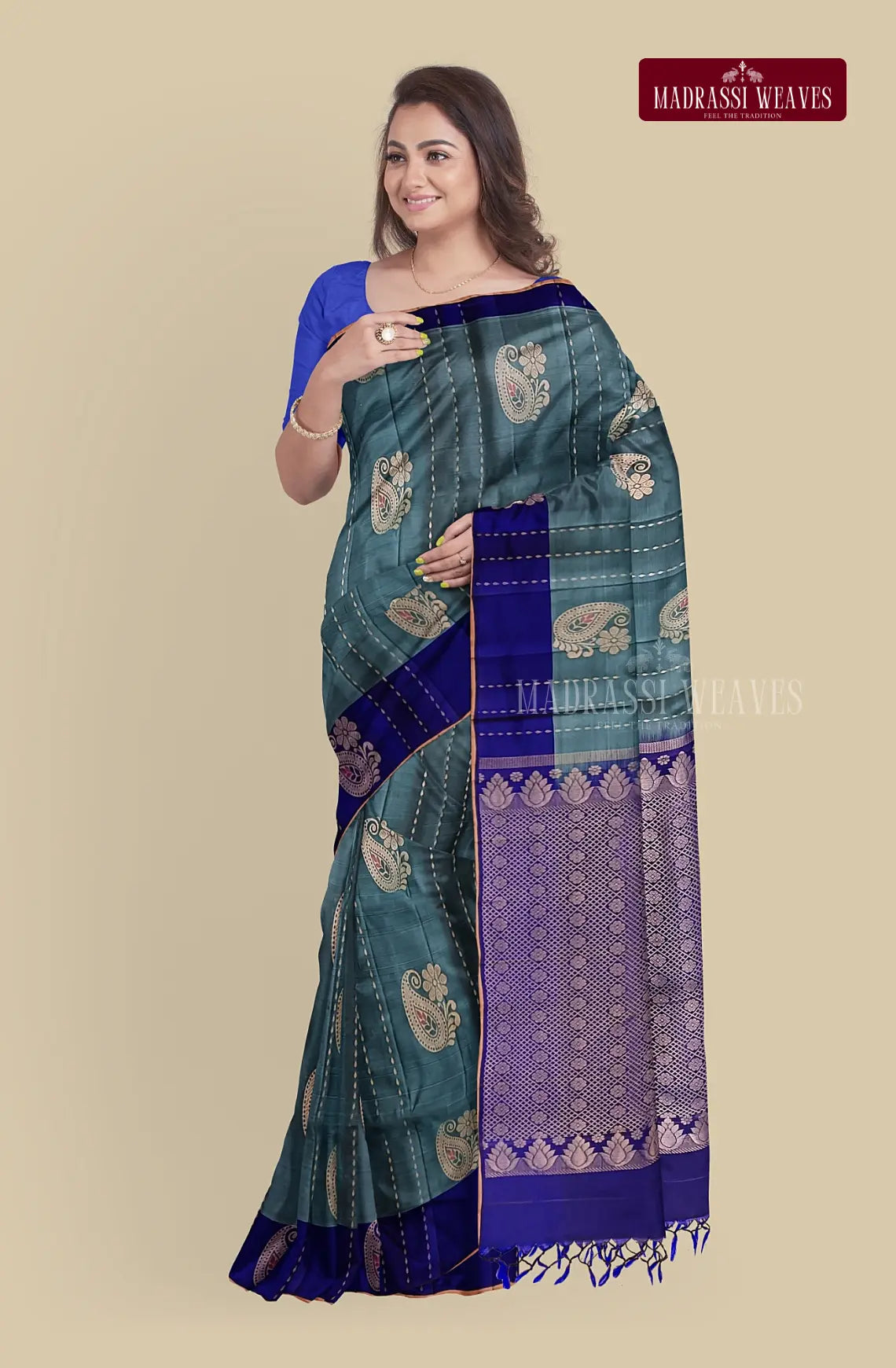 This pure silk saree in a gorgeous pale blue color boasts intricate meena butta work and zari weaving, making it a stunning choice for weddings. It is silk mark certified and even comes with attached blouse material for your convenience. Elevate your style and buy online now!