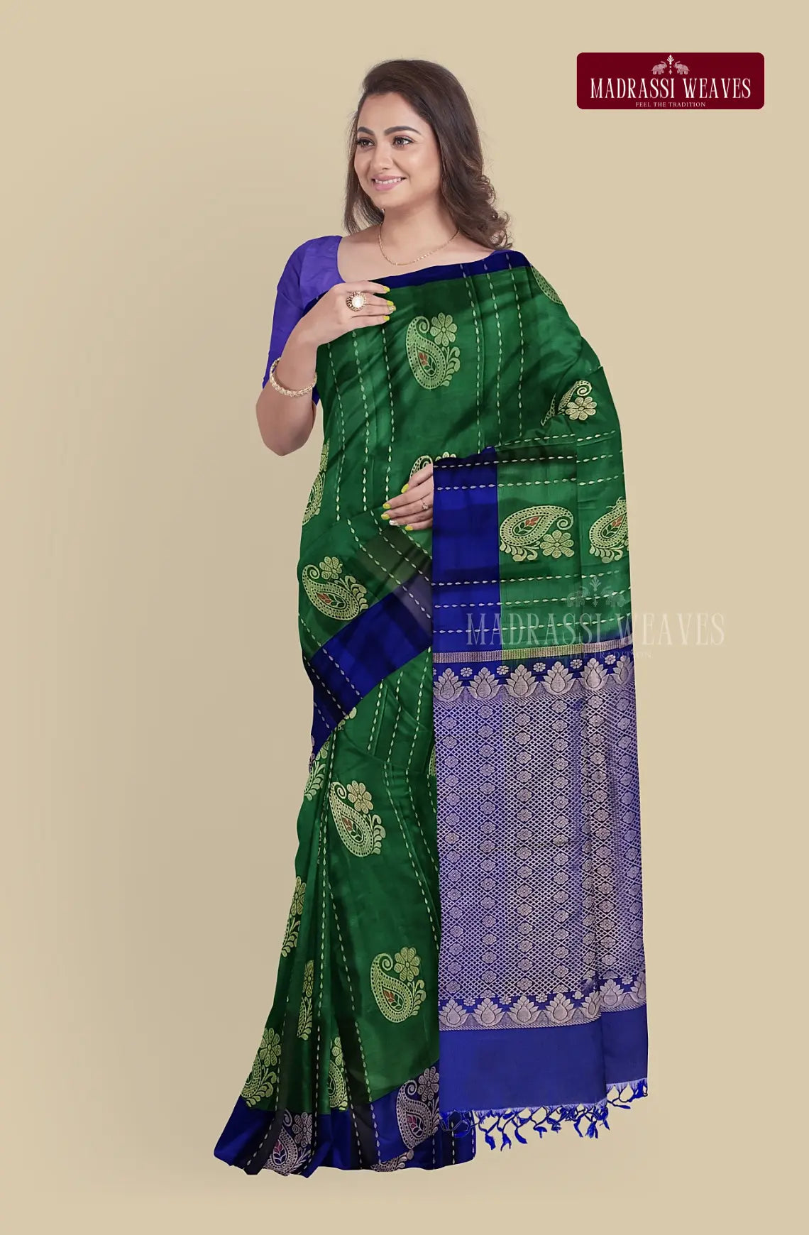 This Kanjeevaram Pure Silk Saree in Green is a stunning addition to any wardrobe. Made from pure silk with intricate meena butta work and zari weaving, it exudes elegance and sophistication. Perfect for weddings and other special occasions, this saree is also Silk Mark certified for quality assurance. The attached blouse material makes it convenient to buy online and complete the look.