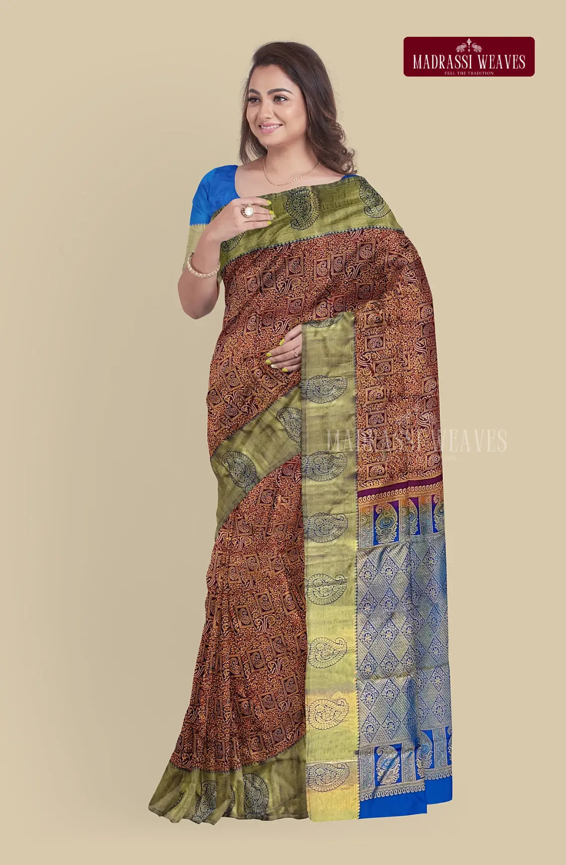 Elevate your look with our Kanjeevaram Pure Silk Saree in a luxurious maroon color. Adorned with exquisite meena butta work and intricate zari weaving, this saree is perfect for weddings. It is silk mark certified and comes with a attached blouse material. Shop now for a timeless and elegant addition to your wardrobe.