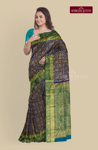 Experience the luxurious elegance of our Kanjeevaram Pure Silk Saree in beautiful Violet. Adorned with intricate Meena Butta work and stunning Zari woven design, this saree is Silk Mark certified and perfect for weddings. Blouse material attached, buy online now to elevate your saree collection!