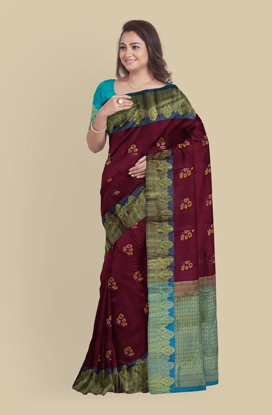 This Kanjeevaram pure silk saree is expertly crafted with zari woven and meena butta work. Its rich wine red color makes it perfect for weddings. Silk mark certified, it comes with attached blouse material and can be purchased online. Don't miss this opportunity to own a piece of Indian tradition.