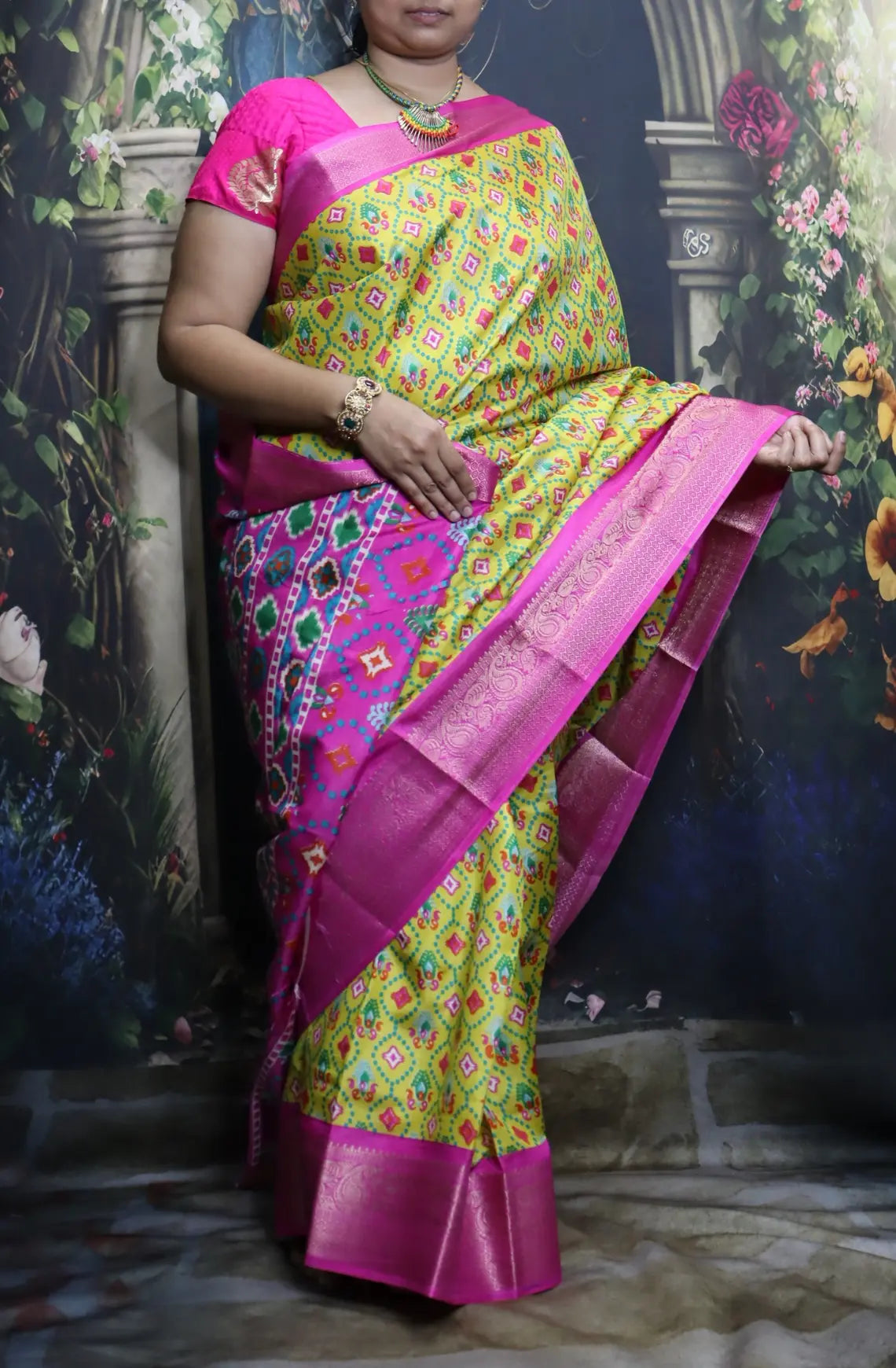 Elevate your style with our Patola Printed Saree! Made with fancy dola silk, it features a vibrant patola print and a stunning zari woven border. The rich mustard saree is accented with a maroon mango border, while the attached blouse material completes the ensemble. Available in six colours. Enjoy free shipping and an affordable price.