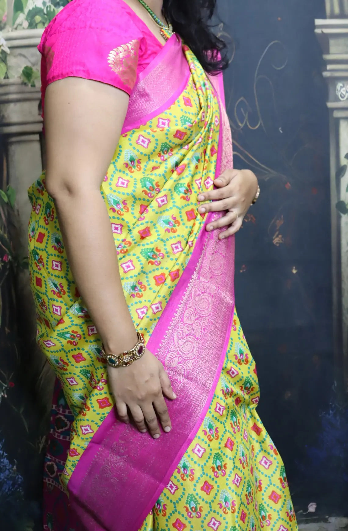 Elevate your style with our Patola Printed Saree! Made with fancy dola silk, it features a vibrant patola print and a stunning zari woven border. The rich mustard saree is accented with a maroon mango border, while the attached blouse material completes the ensemble. Available in six colours. Enjoy free shipping and an affordable price.