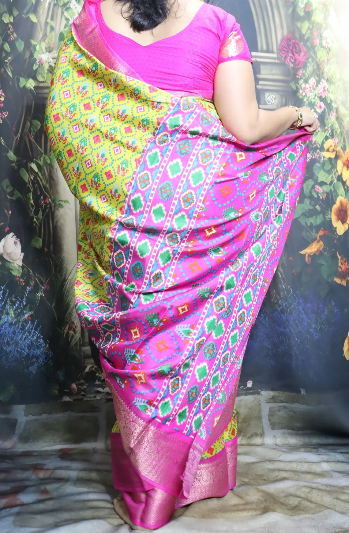 Elevate your style with our Patola Printed Saree! Made with fancy dola silk, it features a vibrant patola print and a stunning zari woven border. The rich mustard saree is accented with a maroon mango border, while the attached blouse material completes the ensemble. Available in six colours. Enjoy free shipping and an affordable price.